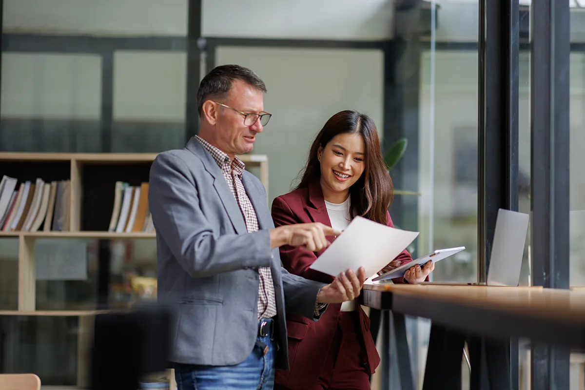 Business professionals reviewing benefits resources